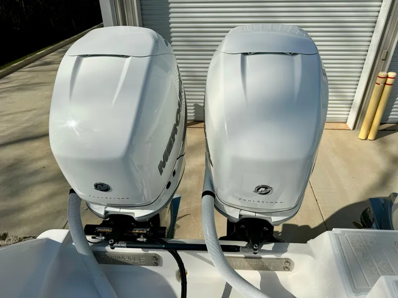 Slide: The Image of Twin Mercury outboard engines on a 2020 Invincible 37 Catamaran. - 26