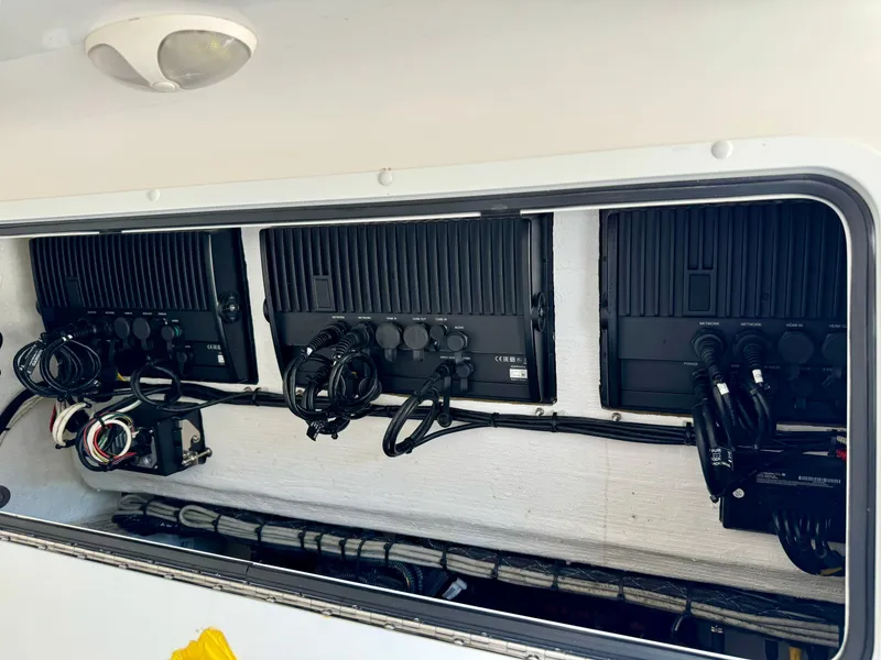 Slide: The Image of 2020 Invincible 37 Catamaran electrical panel with organized wiring and components. - 30