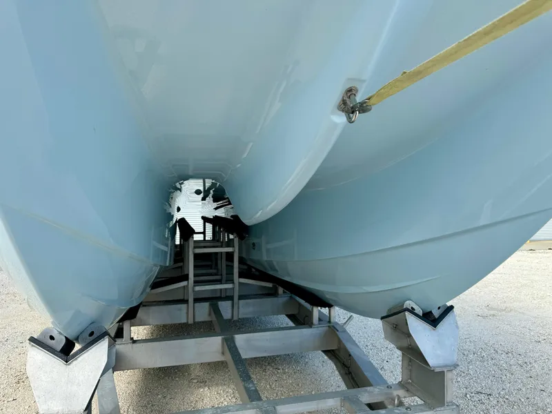 Slide: The Image of 2020 Invincible 37 Catamaran hull on trailer, showcasing sleek design and structure. - 32