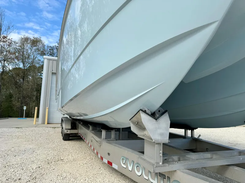 Slide: The Image of 2020 Invincible 37 Catamaran on trailer, showcasing sleek hull design and sturdy construction. - 33