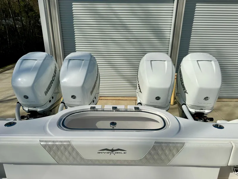 Slide: The Image of Four powerful outboard motors on a 2020 Invincible 37 Catamaran, ready for high-speed adventures. - 8