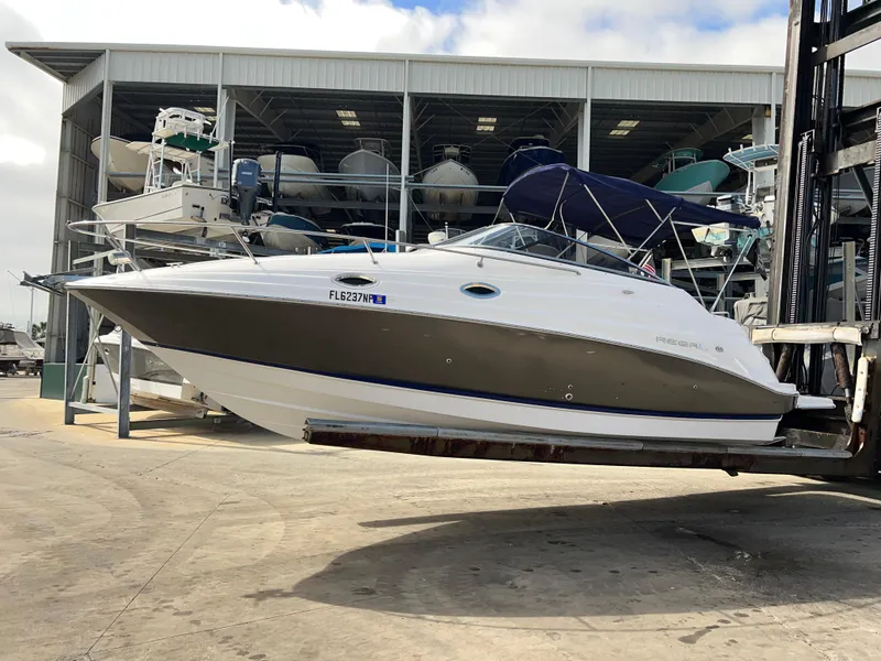 Slide: The Image of 2008 Regal 2665 boat in storage facility, side view. - 2
