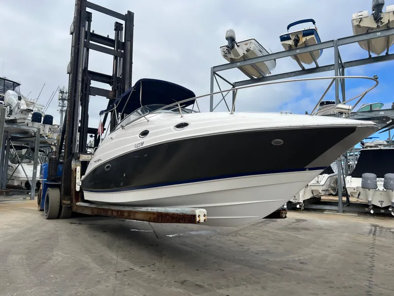 Slide: The Image of 2008 Regal 2665 boat on forklift in marina storage area. - 21