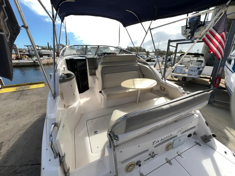 Slide: The Image of 2008 Regal 2665 boat with seating area and table, docked at marina. - 5