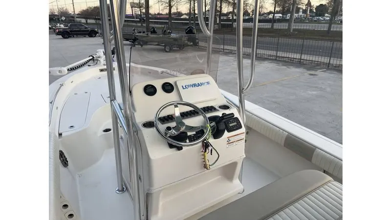 Slide: The Image of 2019 Sea Chaser 23 LX boat console with steering wheel and navigation equipment. - 10