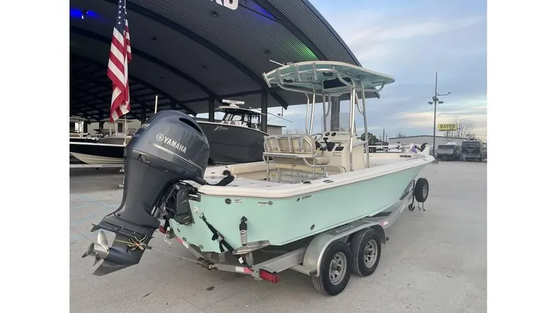 Slide: The Image of 2019 Sea Chaser 23 LX boat with Yamaha outboard motor on a trailer. - 2