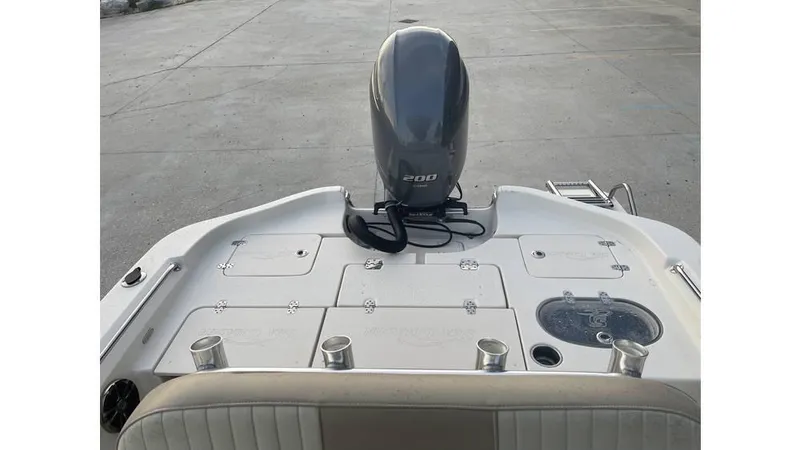 Slide: The Image of 2019 Sea Chaser 23 LX boat with outboard motor and fishing rod holders. - 5