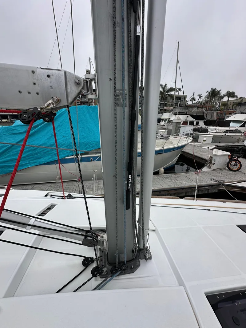 Slide: The Image of 2015 Jeanneau 41DS sailboat mast and rigging at marina dock. - 13