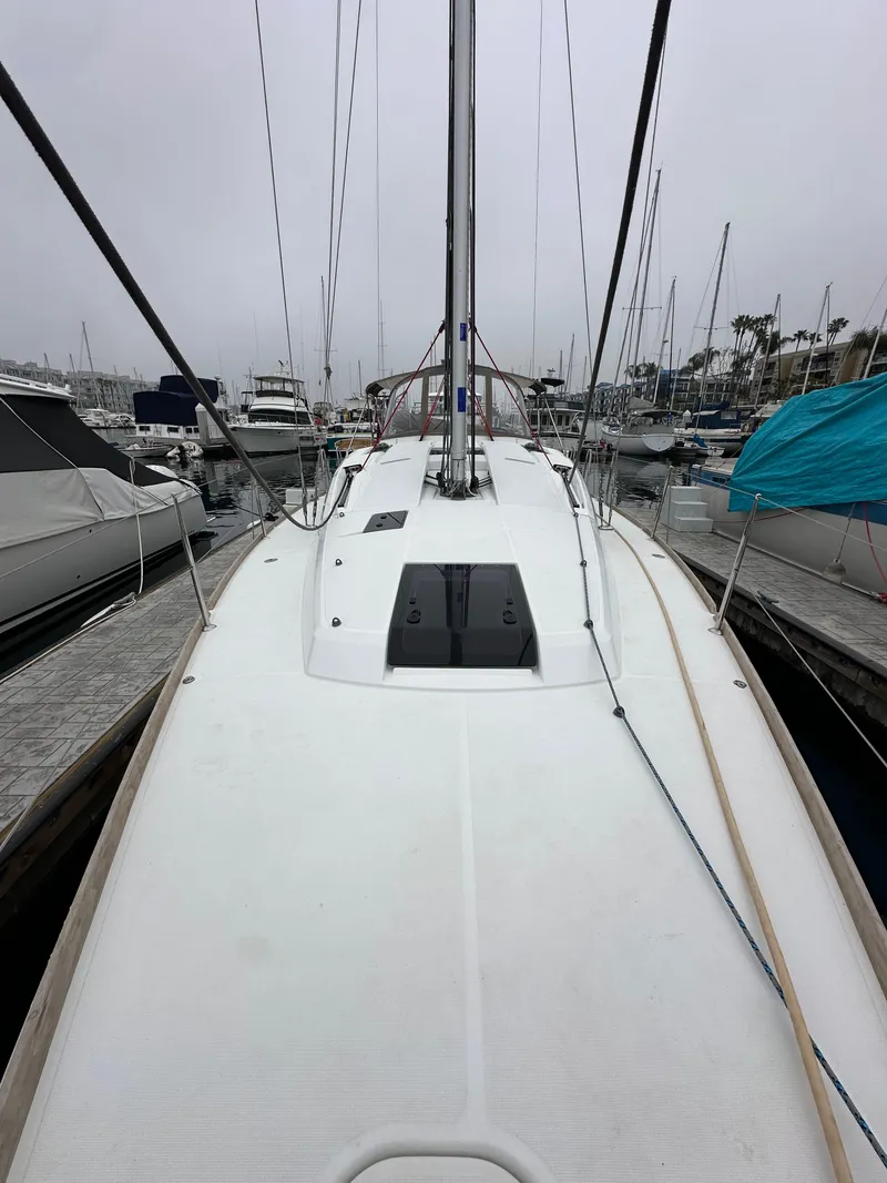 Slide: The Image of 2015 Jeanneau 41DS sailboat docked at marina, overcast sky. - 20