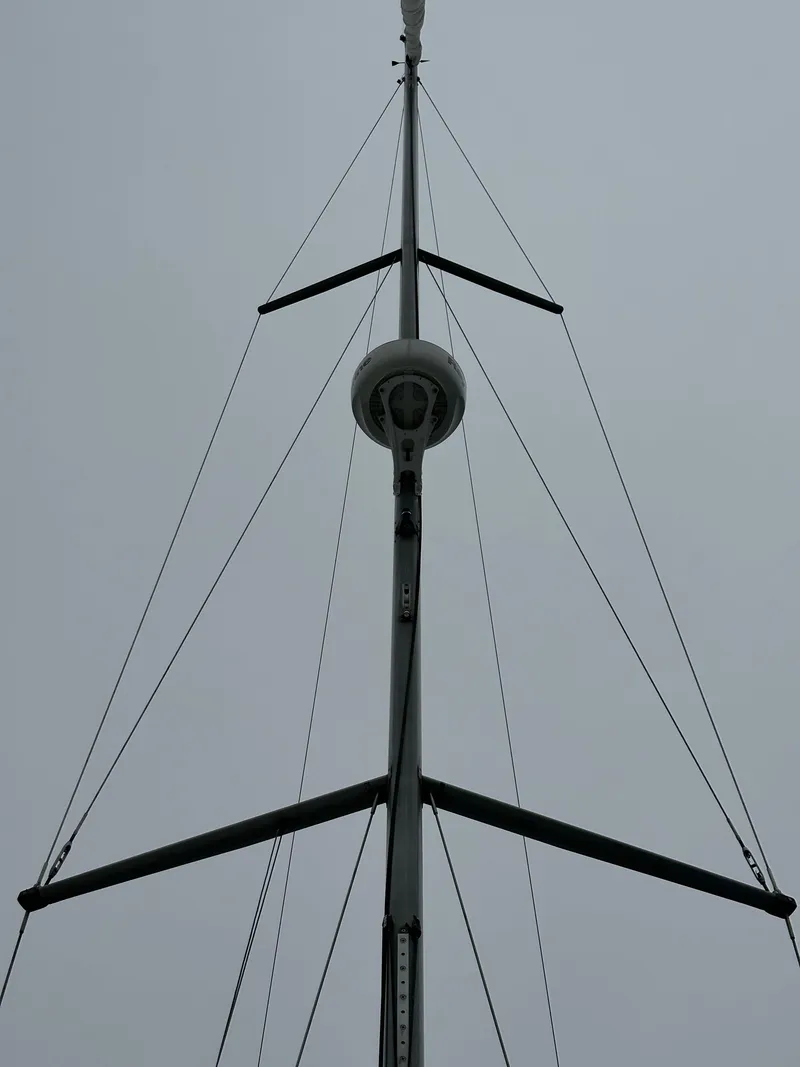 Slide: The Image of Mast of 2015 Jeanneau 41DS sailboat against a cloudy sky. - 21