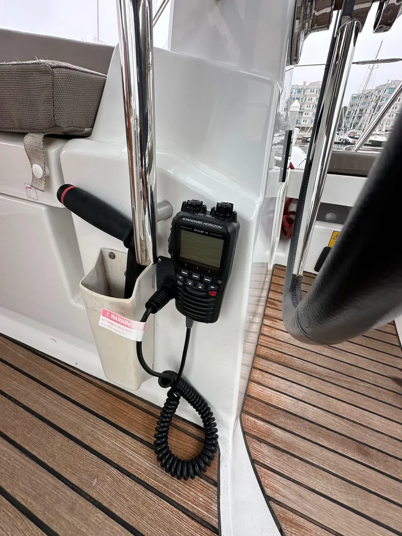 Slide: The Image of Jeanneau 41DS 2015 yacht cockpit with radio and wooden flooring. - 37