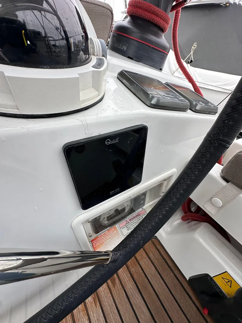 Slide: The Image of 2015 Jeanneau 41DS yacht cockpit with navigation equipment and teak flooring. - 38