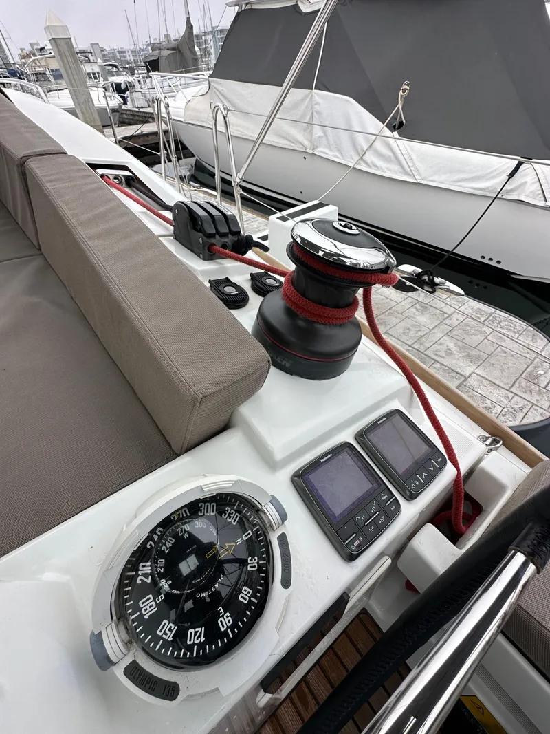 Slide: The Image of Jeanneau 41DS 2015 sailboat cockpit with compass, winch, and navigation instruments. - 40