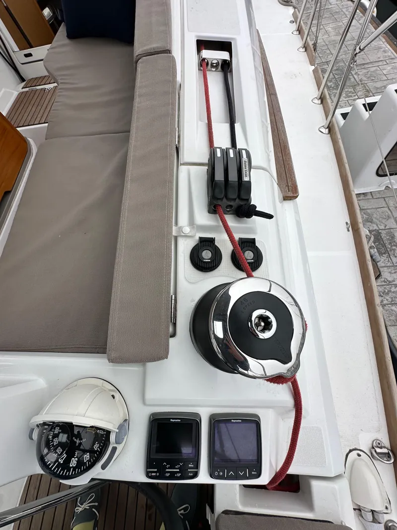 Slide: The Image of Jeanneau 41DS 2015 sailboat deck with winch, rope, and navigation instruments. - 41