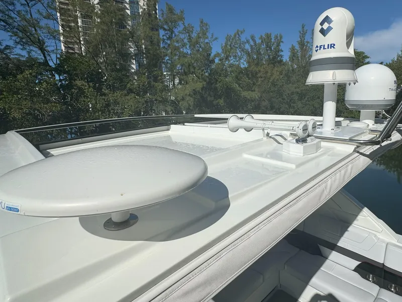 Slide: The Image of 2022 Formula 380 Super Sport Crossover OB boat with open storage compartments. - 13