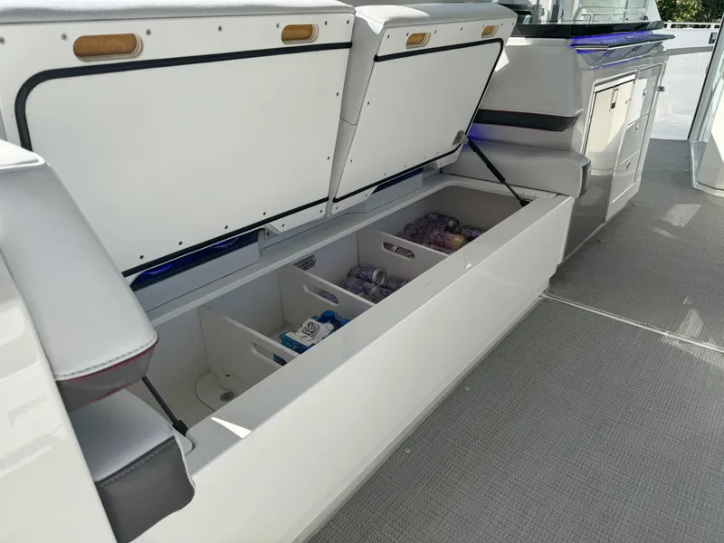 Slide: The Image of Storage compartments with beverages on a 2022 Formula 380 Super Sport Crossover OB boat. - 30