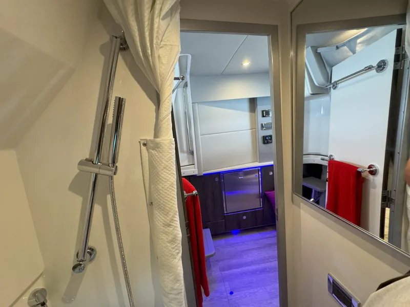 Slide: The Image of Interior of 2022 Formula 380 Super Sport Crossover OB, featuring modern amenities and cozy sleeping area. - 39