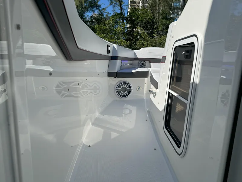 Slide: The Image of 2022 Formula 380 Super Sport Crossover OB boat interior with open storage compartment. - 46