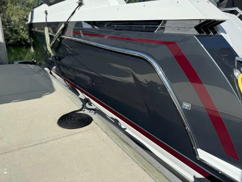 Slide: The Image of 2022 Formula 380 Super Sport Crossover OB boat docked, showcasing sleek design and modern features. - 6