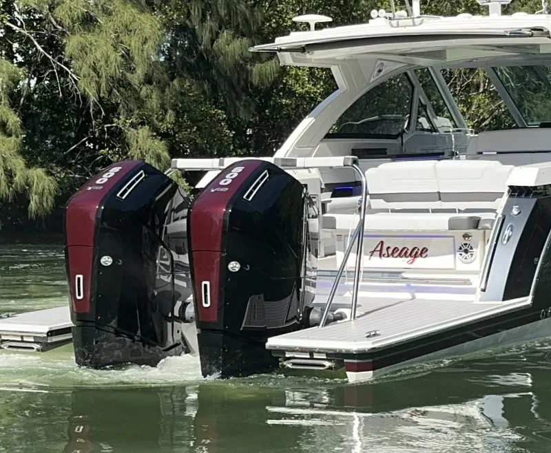 Slide: The Image of 2022 Formula 380 Super Sport Crossover OB cruising on a calm waterway. - 8