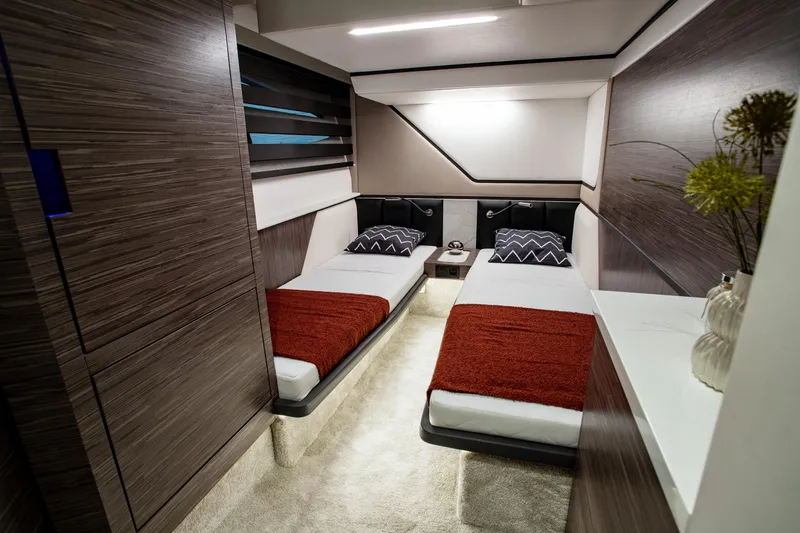 Slide: The Image of Luxurious 2025 Cobrey 45 FLY yacht cabin with twin beds and modern decor. - 10