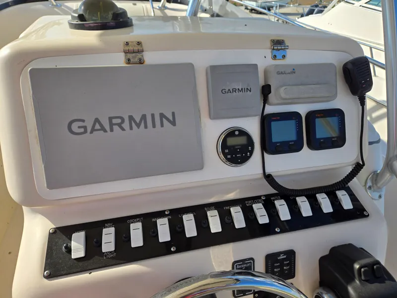 Slide: The Image of Control panel of a 2008 Cobia 316 Sport Cabin with Garmin navigation equipment. - 10