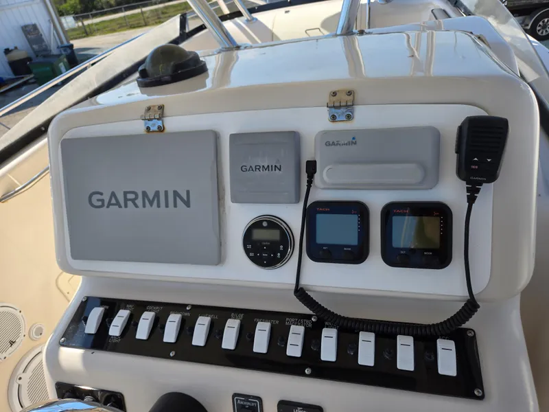 Slide: The Image of Control panel of 2008 Cobia 316 Sport Cabin with Garmin navigation system. - 11
