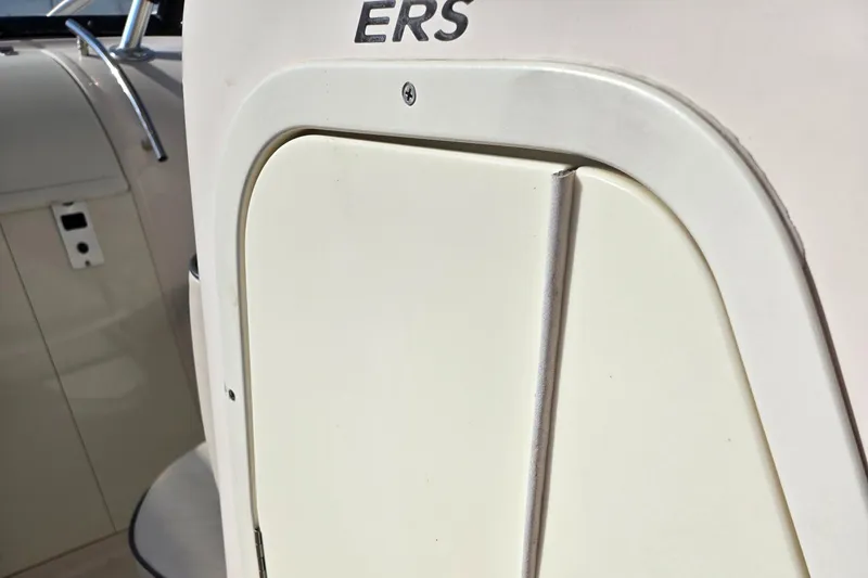 Slide: The Image of 2008 Cobia 316 Sport Cabin boat interior detail with storage compartment. - 24