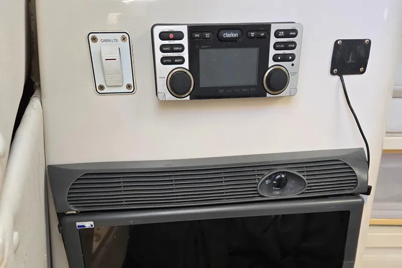 Slide: The Image of 2008 Cobia 316 Sport Cabin interior with control panel and ventilation system. - 30