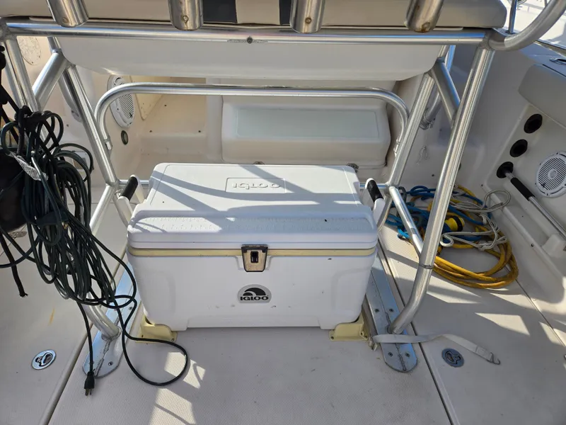 Slide: The Image of 2008 Cobia 316 Sport Cabin interior with cooler and fishing gear. - 37