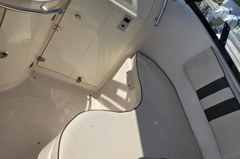 Slide: The Image of 2008 Cobia 316 Sport Cabin interior with seating and storage compartment. - 41