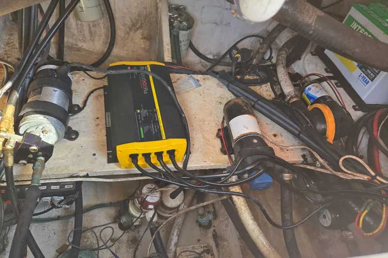 Slide: The Image of Electrical components in a 2008 Cobia 316 Sport Cabin boat engine compartment. - 60