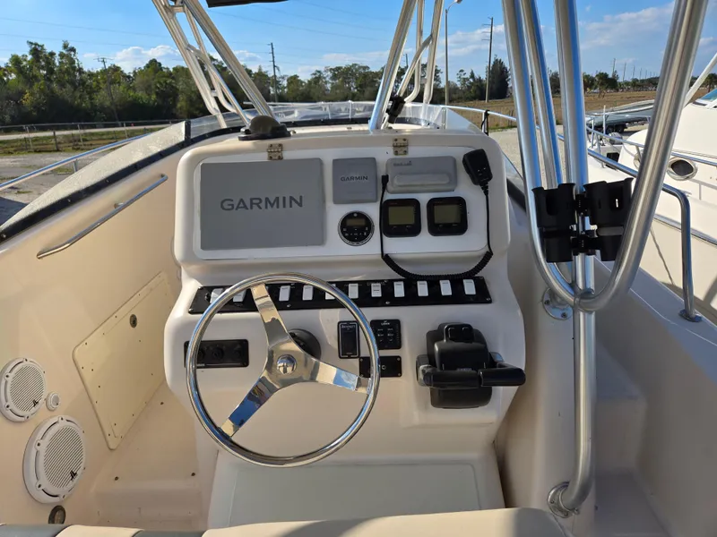 Slide: The Image of 2008 Cobia 316 Sport Cabin boat dashboard with Garmin navigation system. - 8