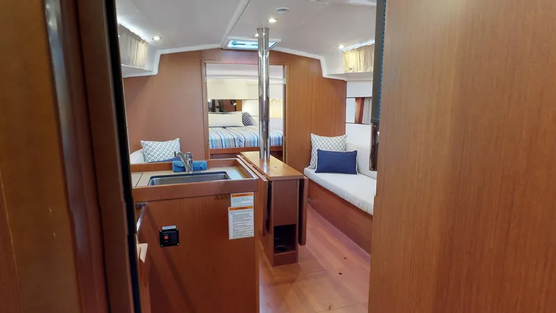 Slide: The Image of Interior of 2019 Beneteau Oceanis 38.1 yacht, featuring cozy seating and modern design. - 20