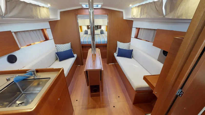 Slide: The Image of Interior of 2019 Beneteau Oceanis 38.1 yacht, featuring cozy seating and modern design. - 25