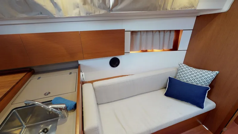 Slide: The Image of Interior of 2019 Beneteau Oceanis 38.1 yacht with cozy seating and modern design. - 28