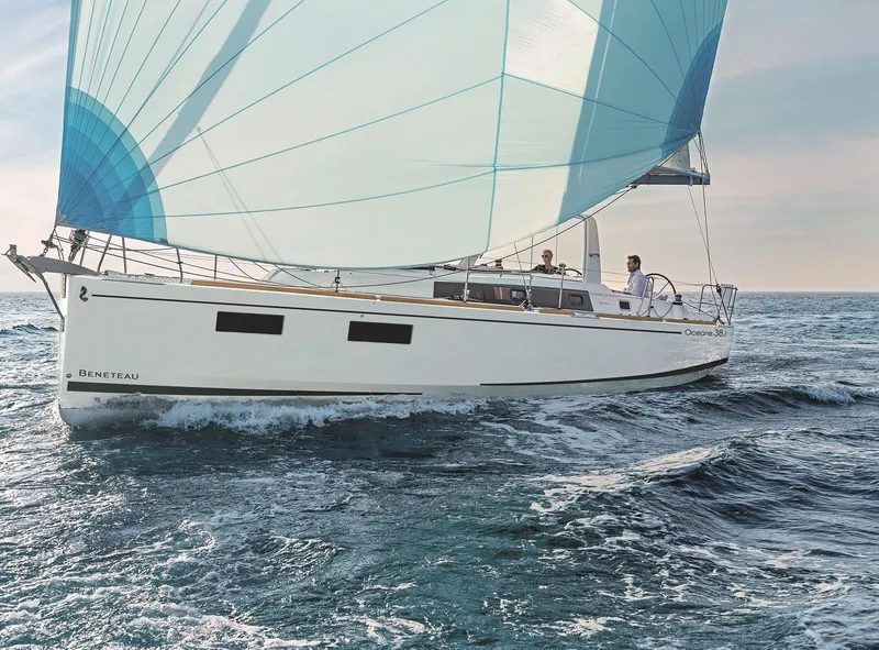 Slide: The Image of 2019 Beneteau Oceanis 38.1 sailing on open sea with blue spinnaker. - 39