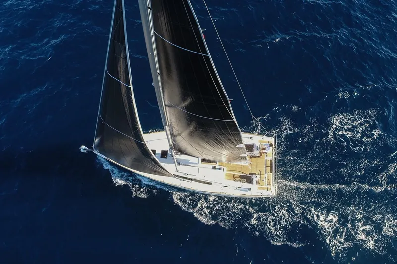 Slide: The Image of Aerial view of 2019 Beneteau Oceanis 38.1 sailing on open blue sea. - 40