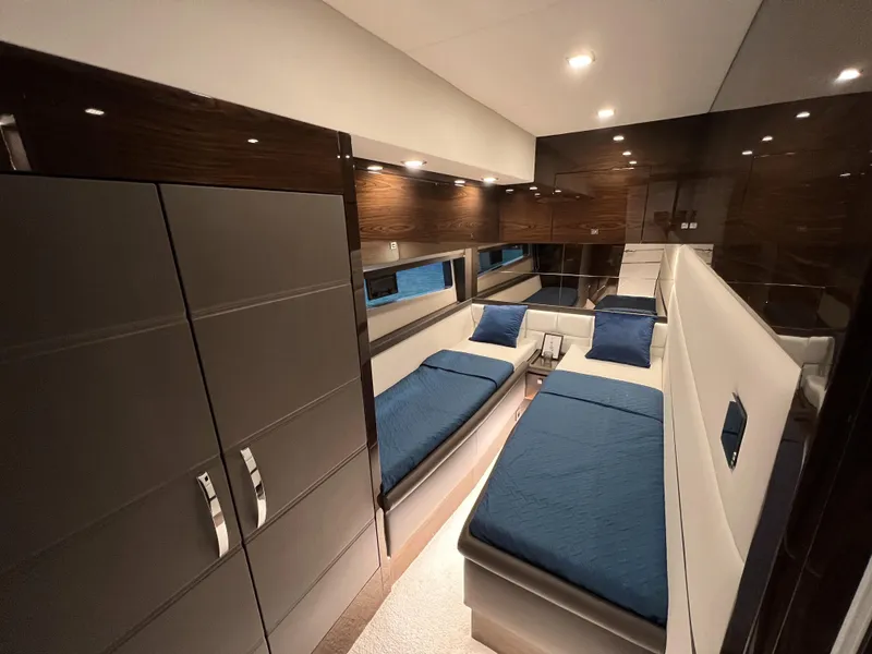 Slide: The Image of Luxurious interior of 2025 Cobrey 52 FLY yacht with twin beds and modern design. - 16