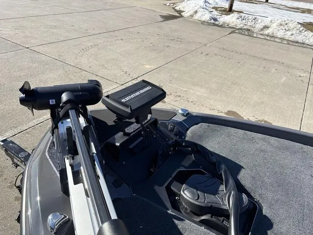 Slide: The Image of 2025 Skeeter ZXR21 boat with trolling motor on a concrete surface. - 10