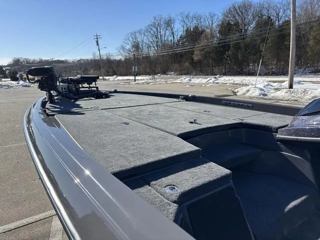 Slide: The Image of 2025 Skeeter ZXR21 boat with spacious deck in a snowy parking lot. - 13