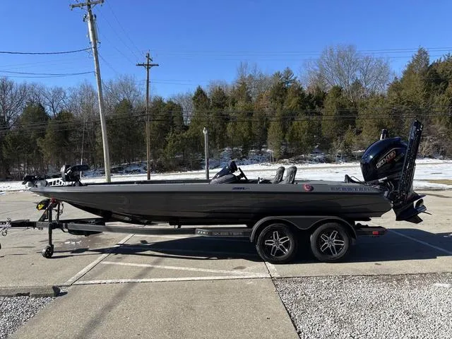 Slide: The Image of 2025 Skeeter ZXR21 boat on trailer, parked outdoors on a sunny day. - 15