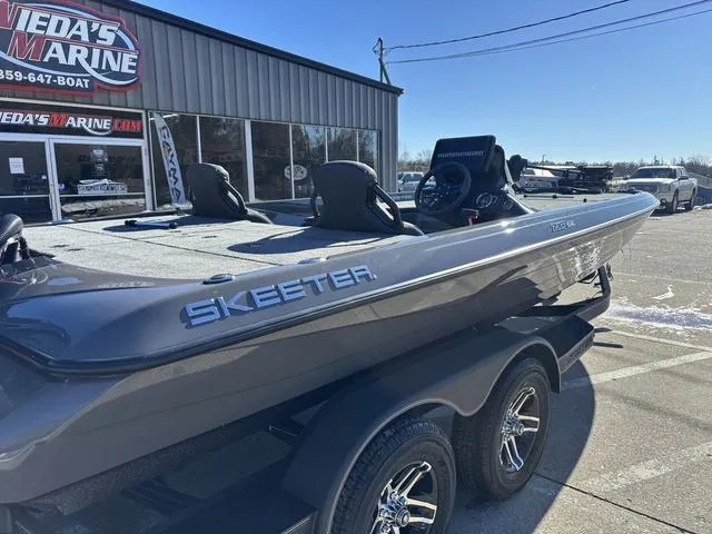 Slide: The Image of 2025 Skeeter ZXR21 boat on trailer outside dealership. - 3