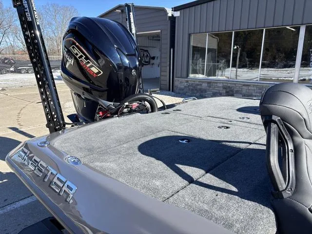 Slide: The Image of 2025 Skeeter ZXR21 boat with powerful engine, parked outside a building. - 5