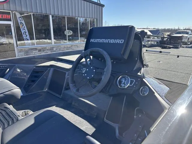 Slide: The Image of 2025 Skeeter ZXR21 boat dashboard with Humminbird electronics, steering wheel, and controls. - 6