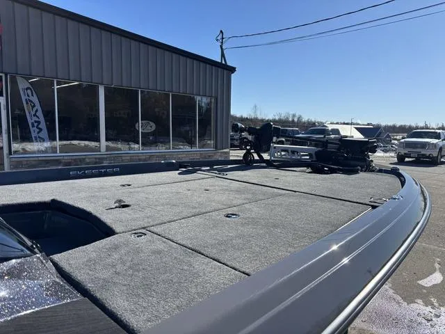 Slide: The Image of 2025 Skeeter ZXR21 boat on display outside dealership under clear blue sky. - 7