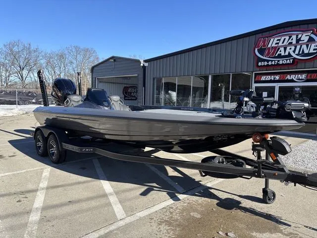 Slide: The Image of 2025 Skeeter ZXR21 boat on trailer outside dealership. - 8