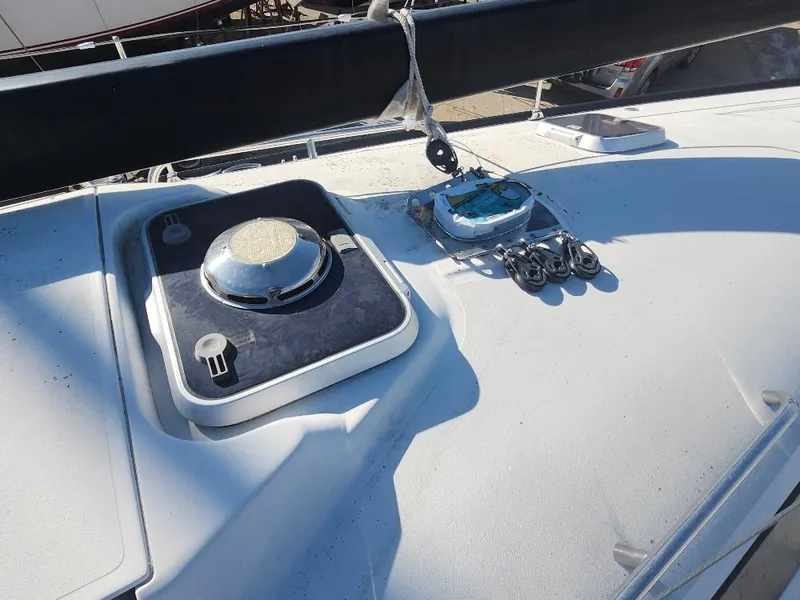 Slide: The Image of Deck of a 2002 C&C 99 sailboat with hatches and rigging equipment. - 10