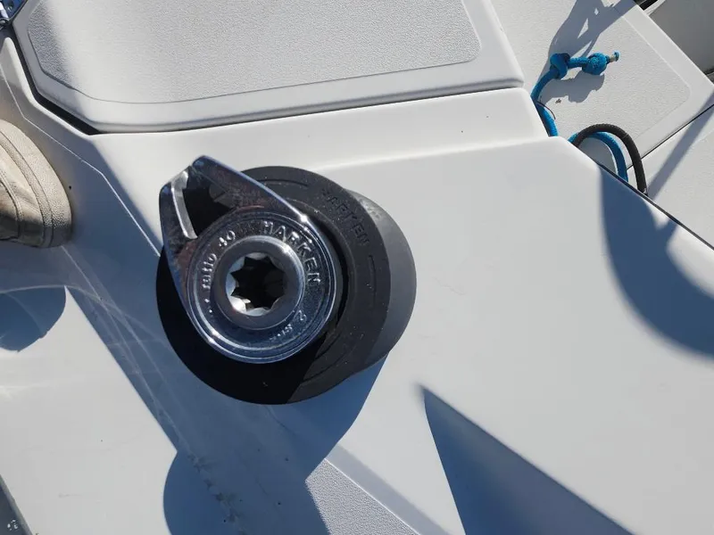 Slide: The Image of Sailboat winch on C&C 99, 2002 model, with blue rope and deck details. - 19