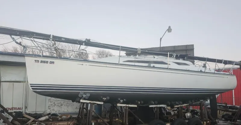 Slide: The Image of Sailboat on stands, C&C 99 model, 2002, in a boatyard setting. - 35
